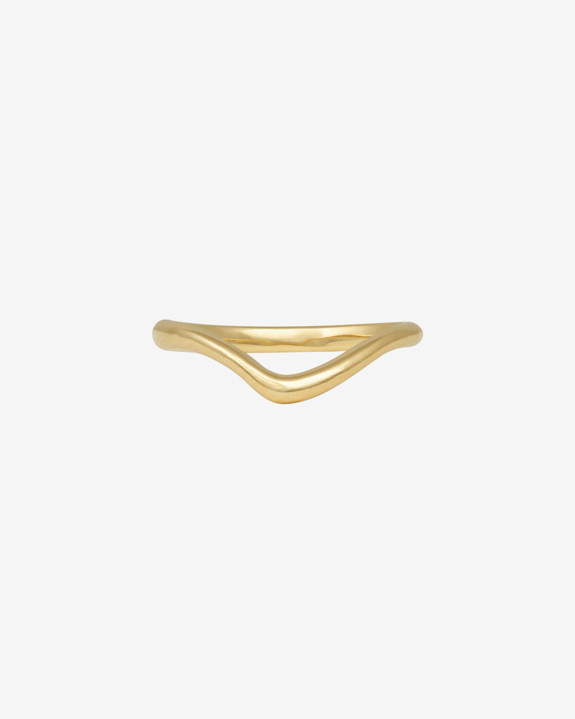 Gold ring with a wavy design on a white background