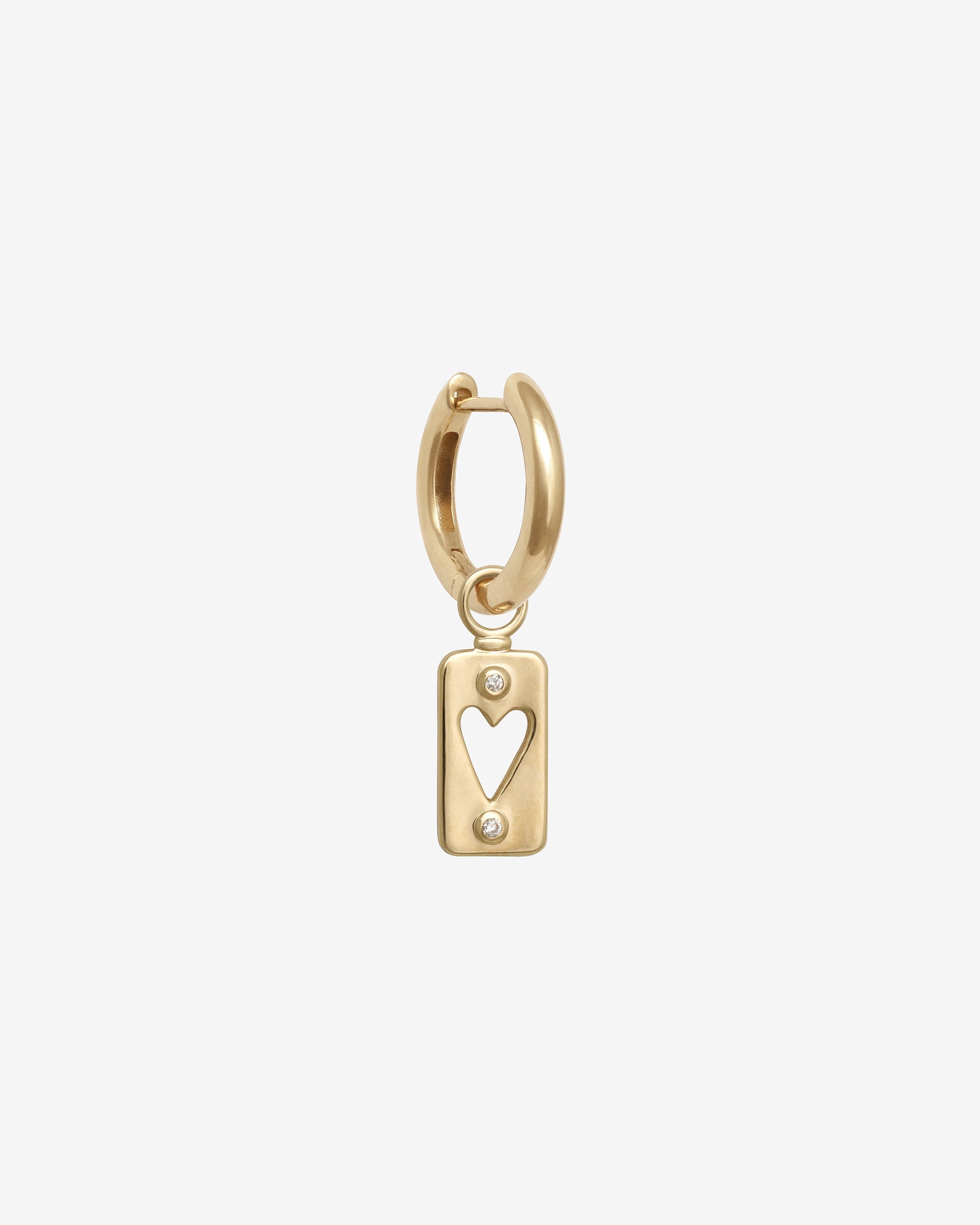 Gold hoop earring with a heart-shaped tag on a white background