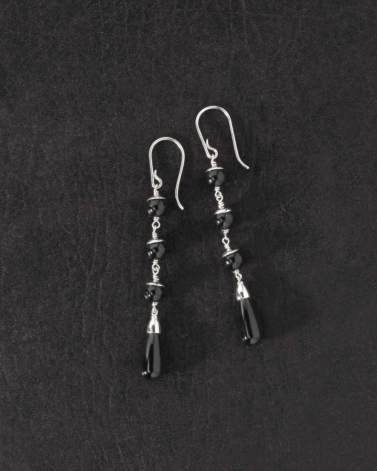 Sita Earrings Silver on dark leather