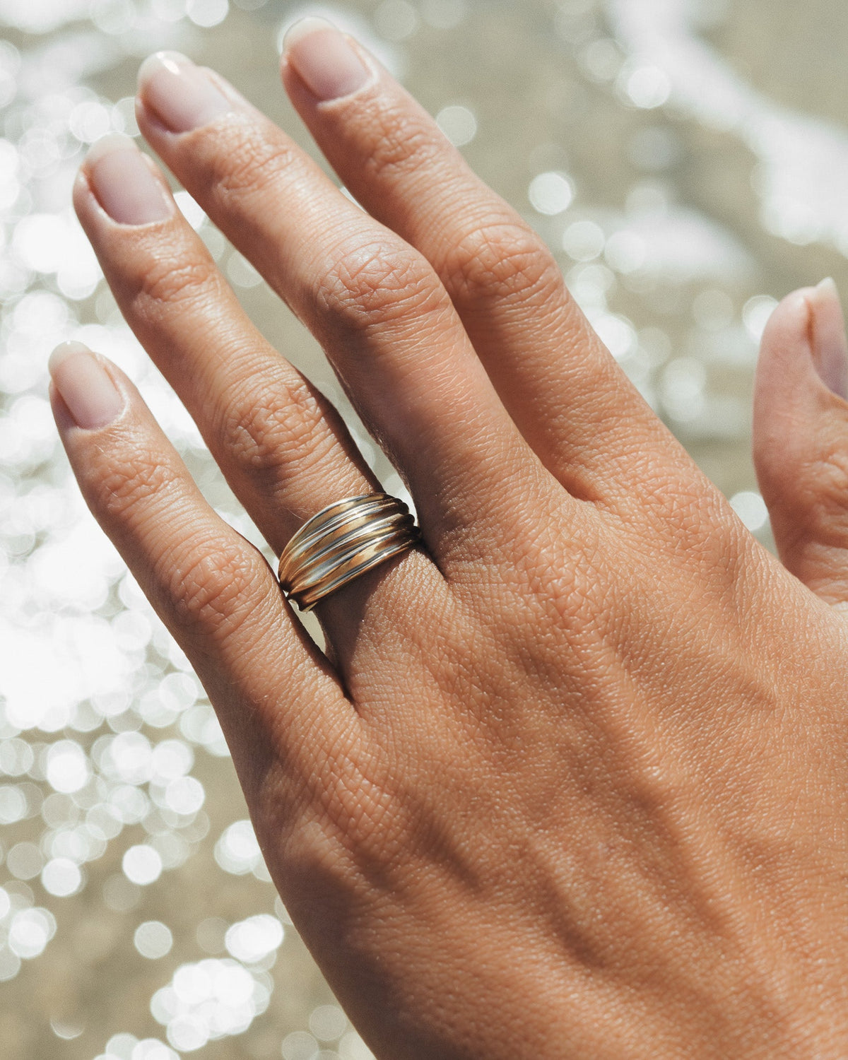 Arc Ring Solid Gold, worn on the hand