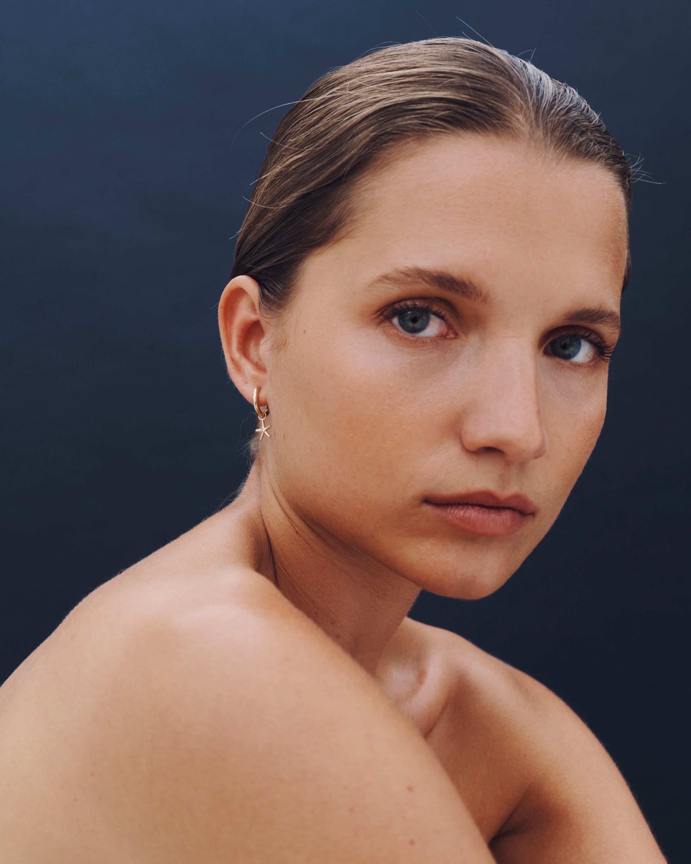 Woman against a dark background