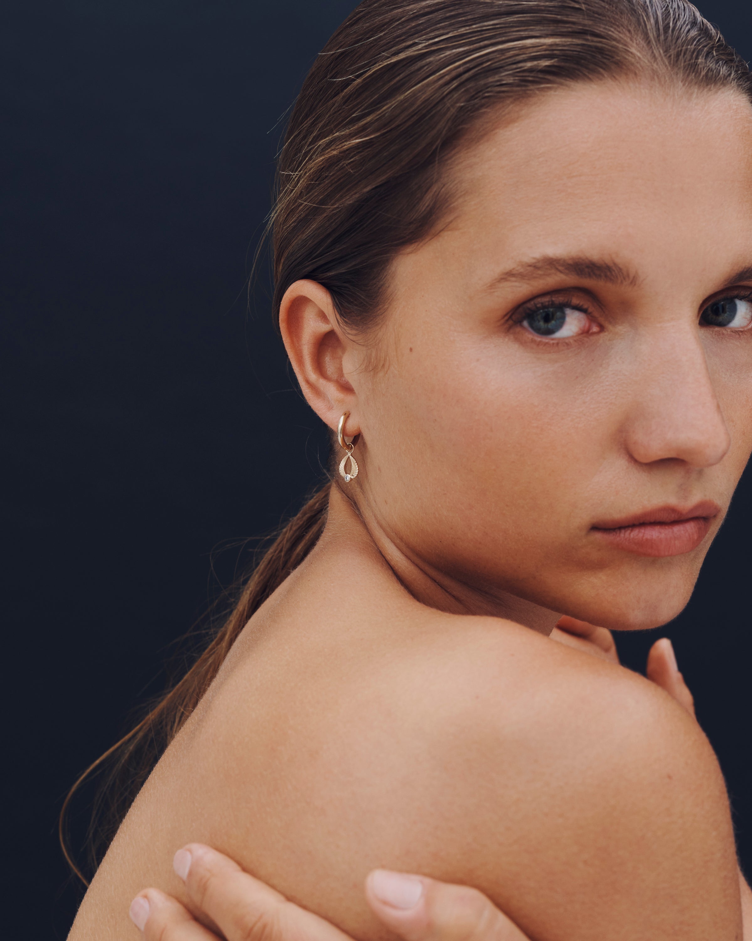 Close-up of a woman's face with a dark background