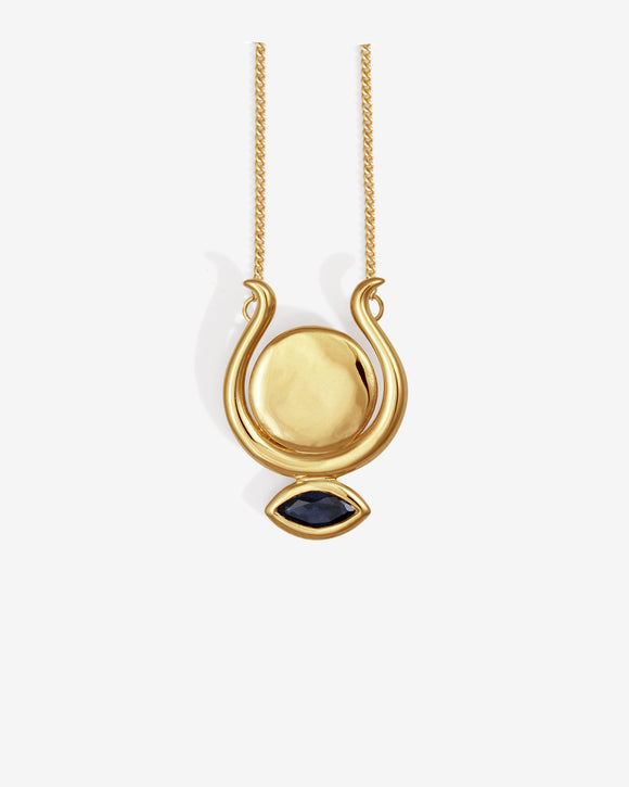 Gold necklace with a pendant featuring a blue gemstone on a white background