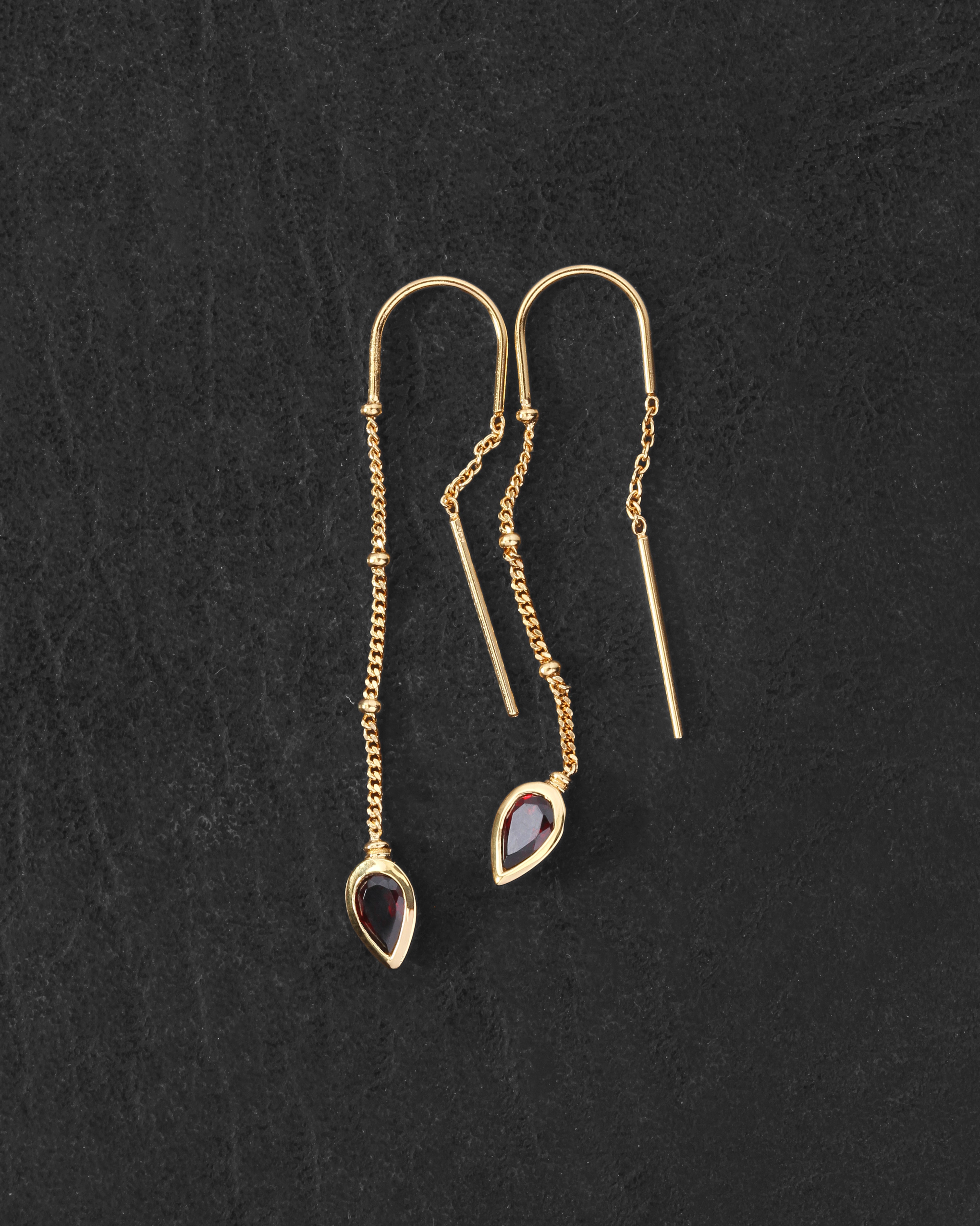 Ignis Earrings Gold Vermeil on dark leather