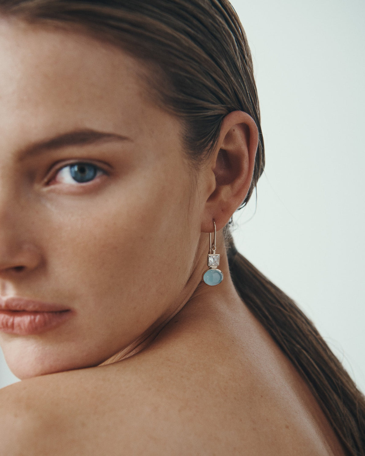 Mara Diamond and Aquamarine Earrings Solid Gold, worn in profile