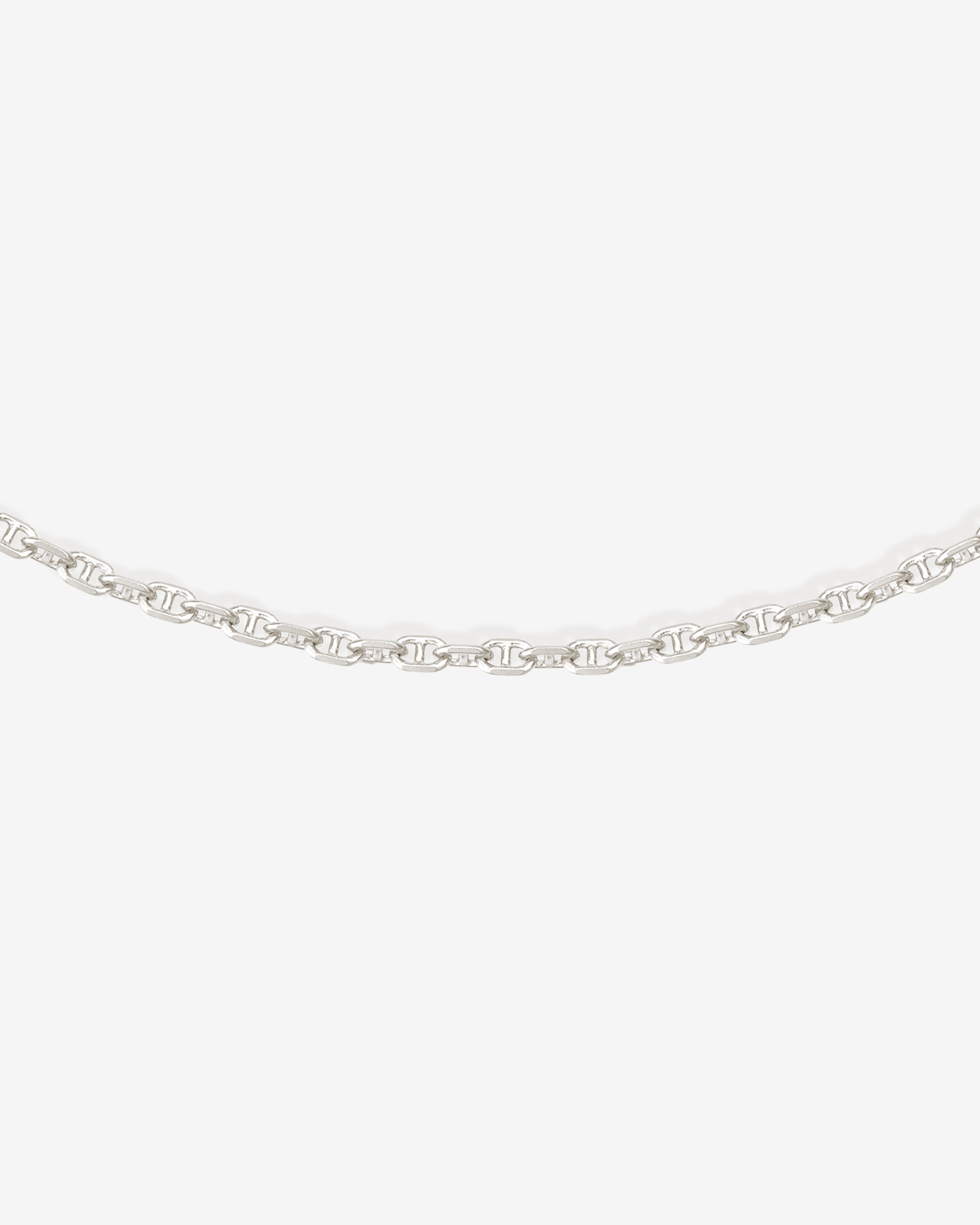 Silver chain necklace on a white background