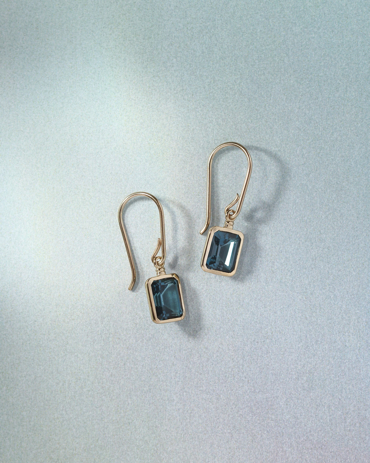 Mu Topaz Earrings Solid Gold, flatlay