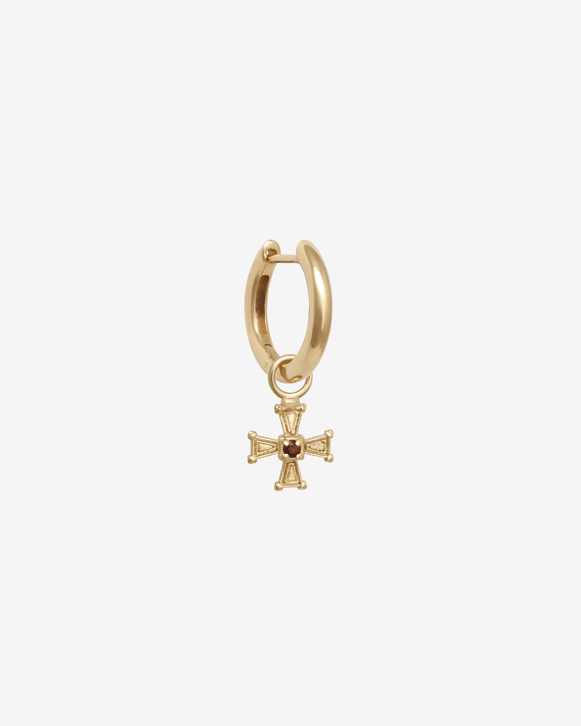 Gold hoop earring with a cross charm on a white background