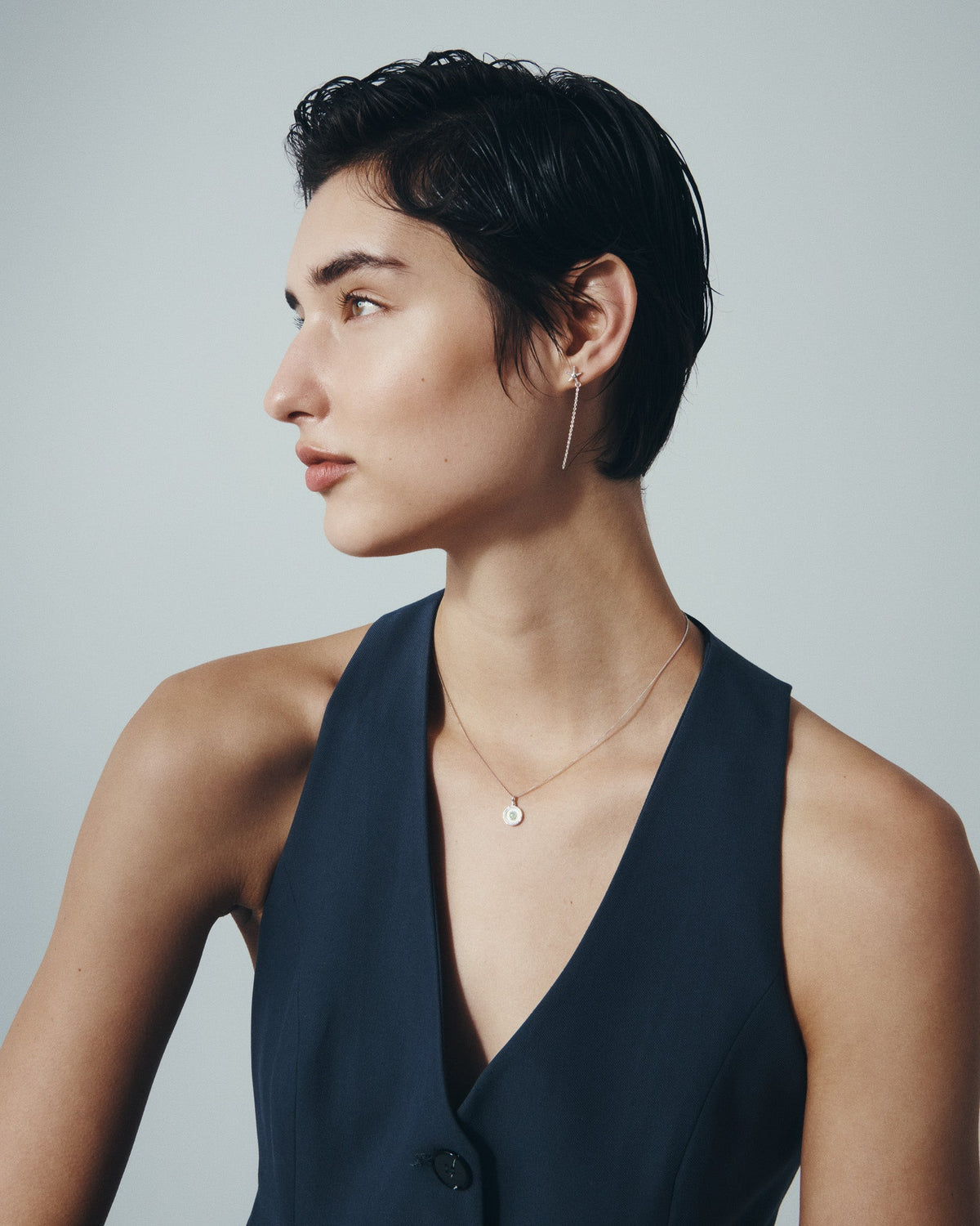 Seba Stud Earrings and Soma Coin Necklace in Silver, worn