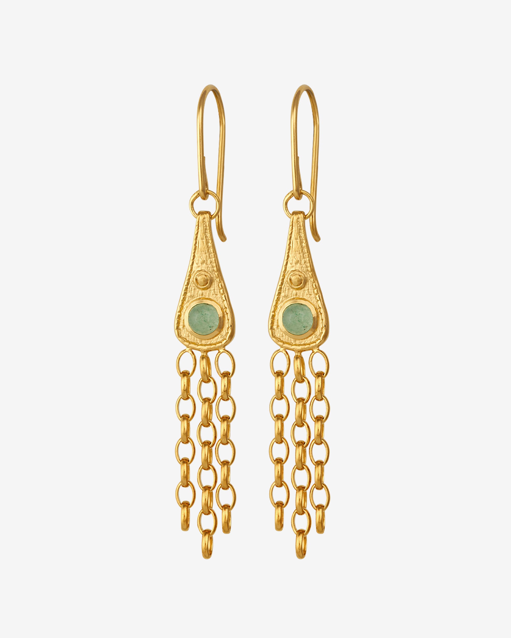Gold earrings with green gemstones on a white background