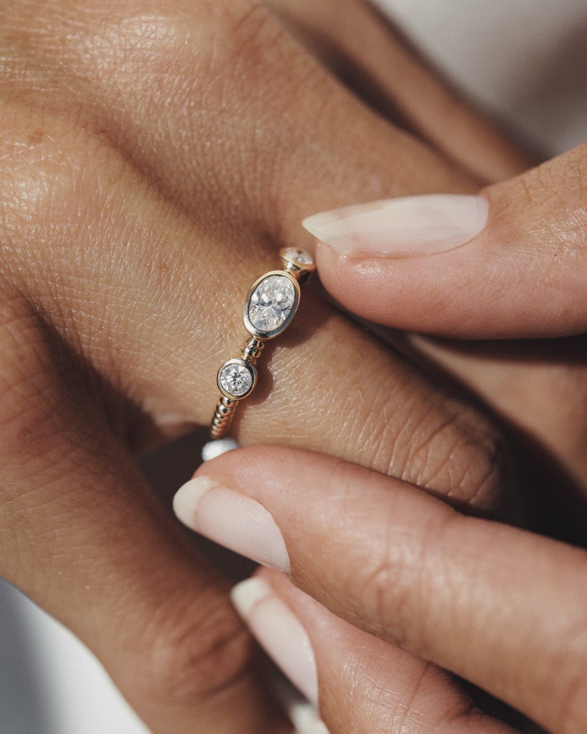 Wren Diamond Trilogy Ring Solid Gold, worn on the hand